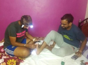 Inderpal attends to the blisters Jayaraman accumulated through the first six days of running. The blisters were lanced, cleaned and taped up so that the duo can continue running (Photo: courtesy Inderpal Singh Khalsa)