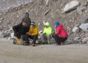 Dariusz (Darek) Strychalski - seen in yellow jacket - exits the 2016 race. Medic Nick Dillon (kneeling) next to him; also seen are Dr Rajat Chauhan and Darek's friend, Anna. Although his race stood terminated, Darek returned to cheer other runners (Photo: Shyam G Menon) 
