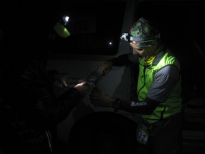 August 11th night. En route to Khardung La, Mark Woolley gets a quick refill of water from one of the support vehicles (Photo: Shyam G Menon) 