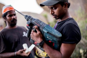 At work, setting up a route on natural rock (Photo: Jyothy Karat)