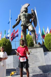 The formal finish at Spartathlon at the foot of the statue of King Leonidas (Photo: Sparta Photography Club / courtesy: Kieren D'Souza)