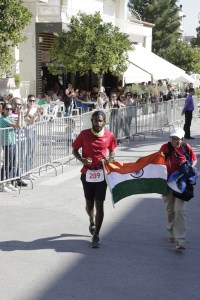 Kieren reaching the finish line of Spartathlon; giving him company is his mother (Photo: Sparta Photography Club / courtesy Kieren D' Souza)